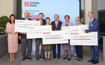 National Graphic Islamic Bank Foundation posted with representatives of various nonprofit organizations in a check donation ceremony.